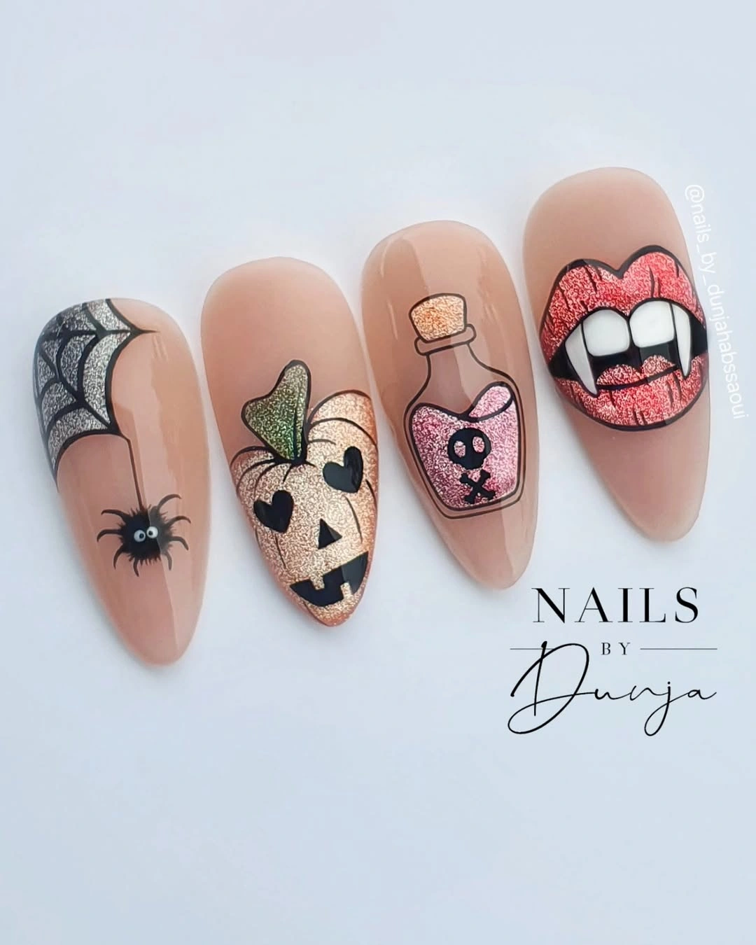 Long nude almond nails with spider potion bottle cat eye and lip art