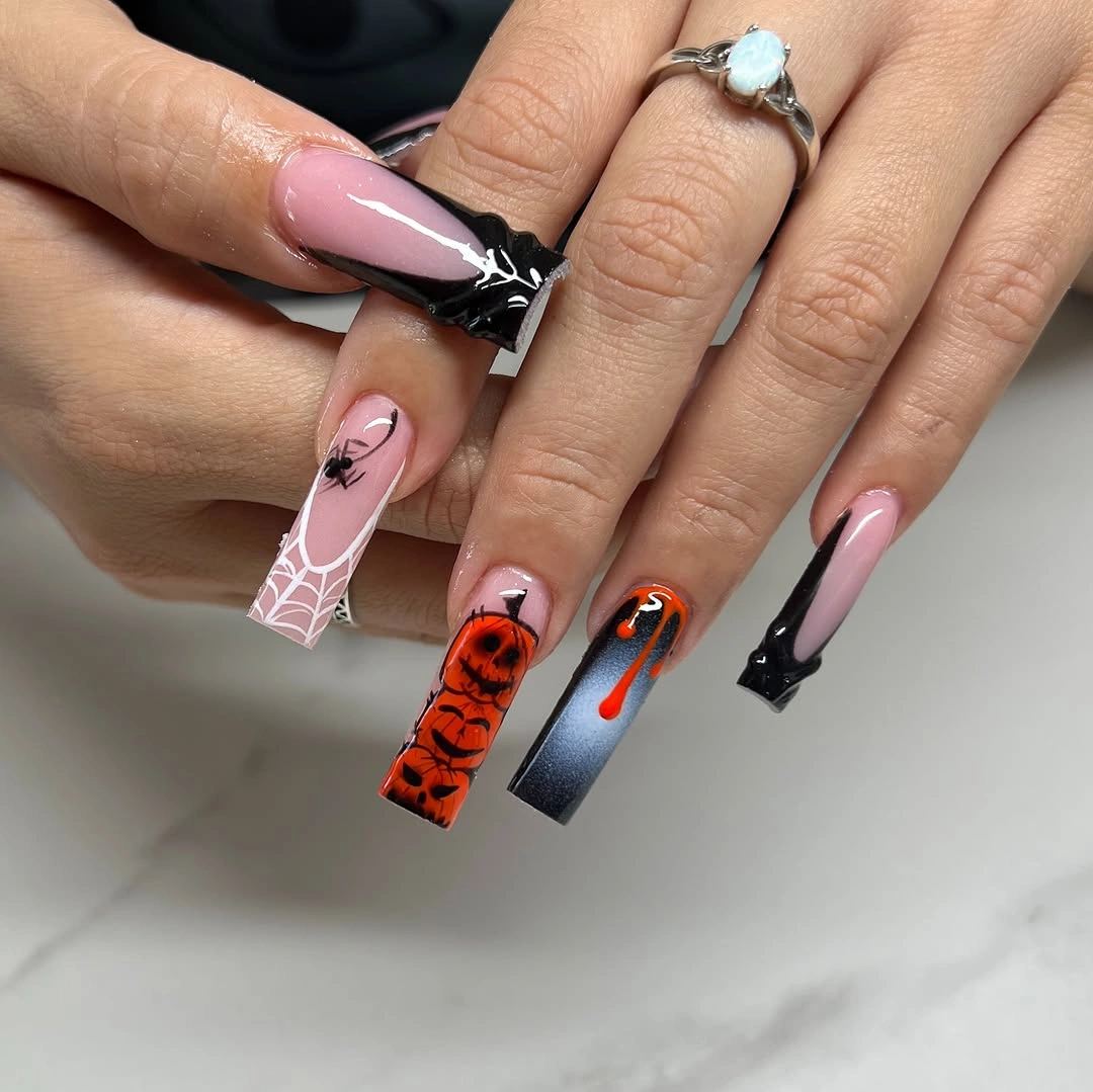 Medium coffin nude nails with black bow web orange pumpkin and red accents