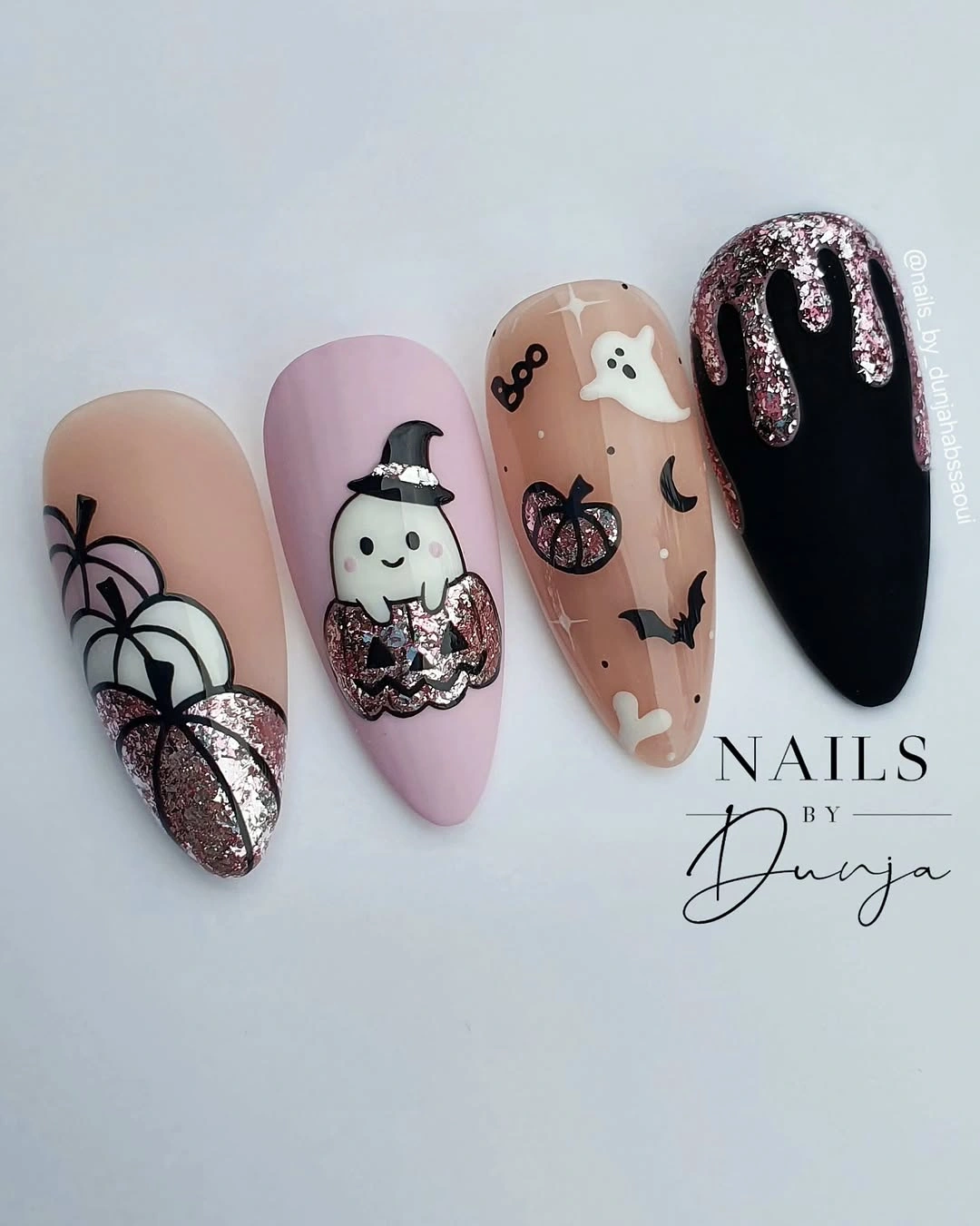 Long nude mauve and black nails with ghost witch hat pumpkin web and silver glitter drip