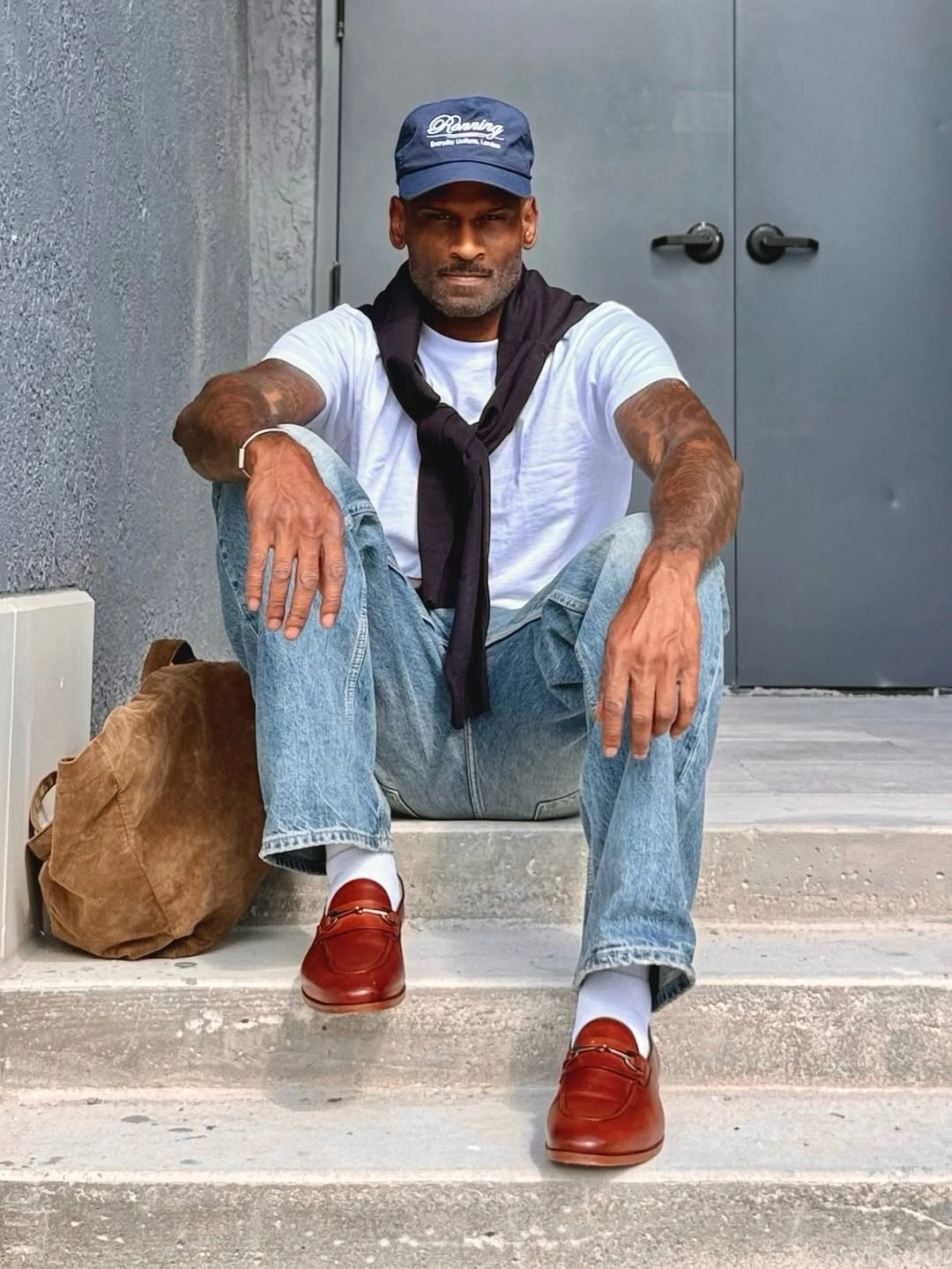 White shirt light jeans burgundy shoulder sweater and burgundy shoes