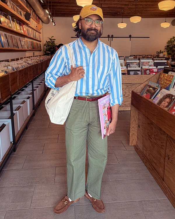 Blue striped shirt olive pleated trousers and brown sandals