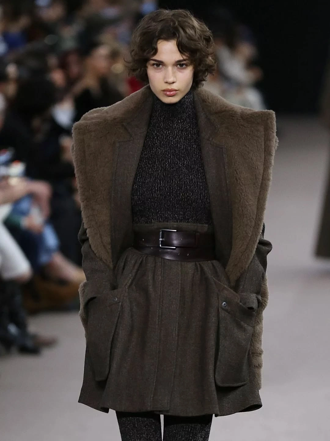 Dark brown outerwear with plush-looking shoulders and wide belt