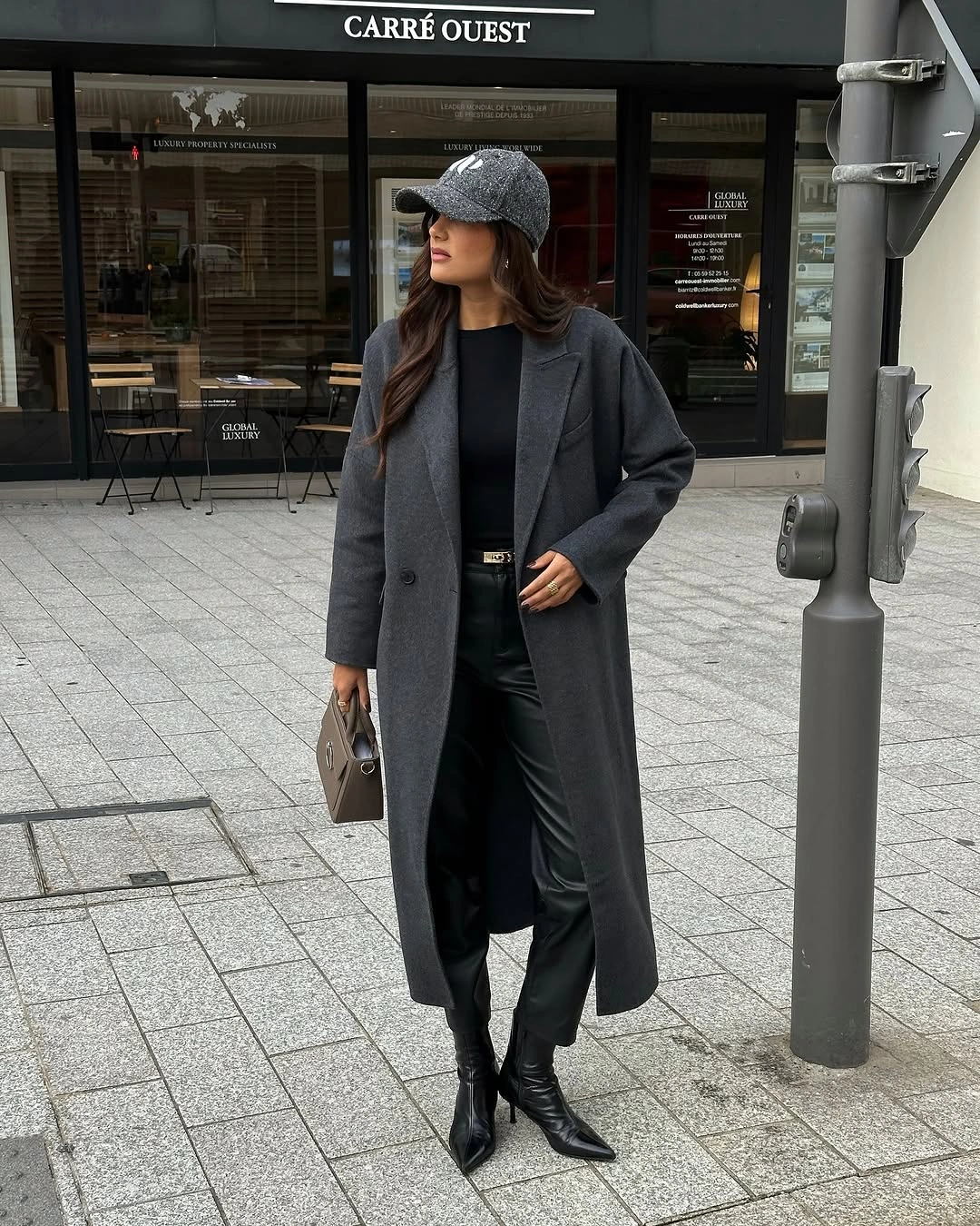 Charcoal coat with glossy black trousers and pointed boots