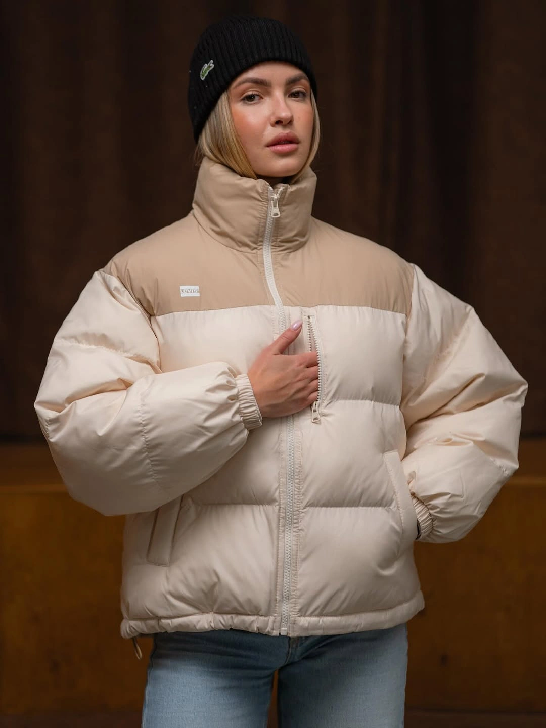 Cream and beige puffer with black beanie and jeans