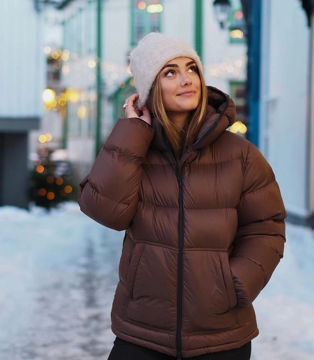 Brown hooded puffer with pale beanie and black base