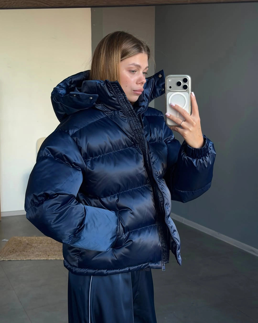 Glossy navy hooded puffer with high collar