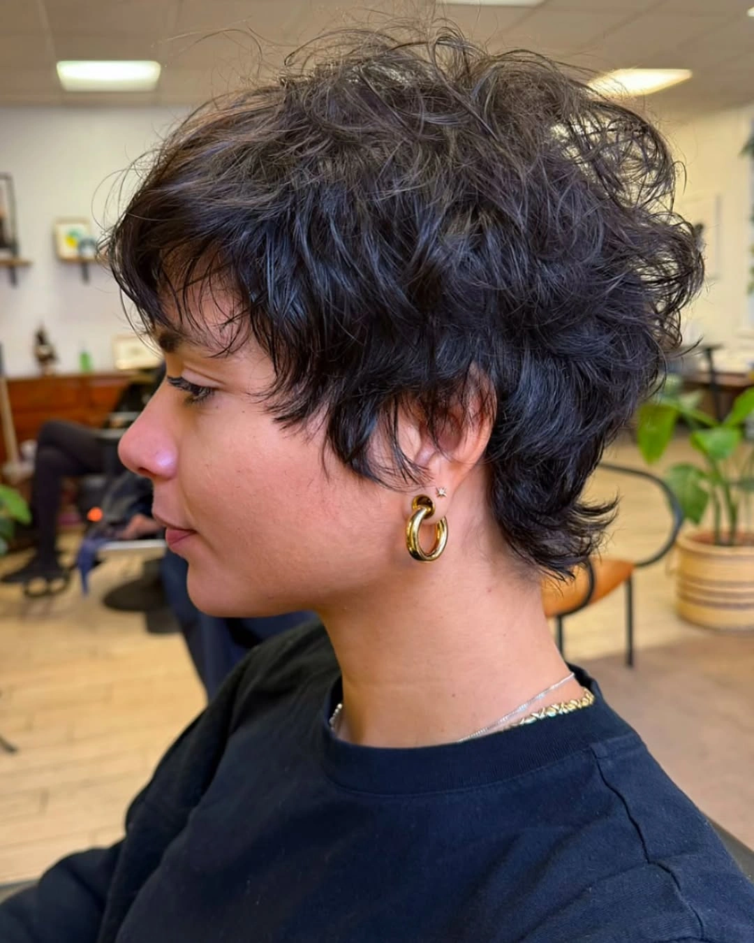 Short dark textured cut with close sides and nape layers