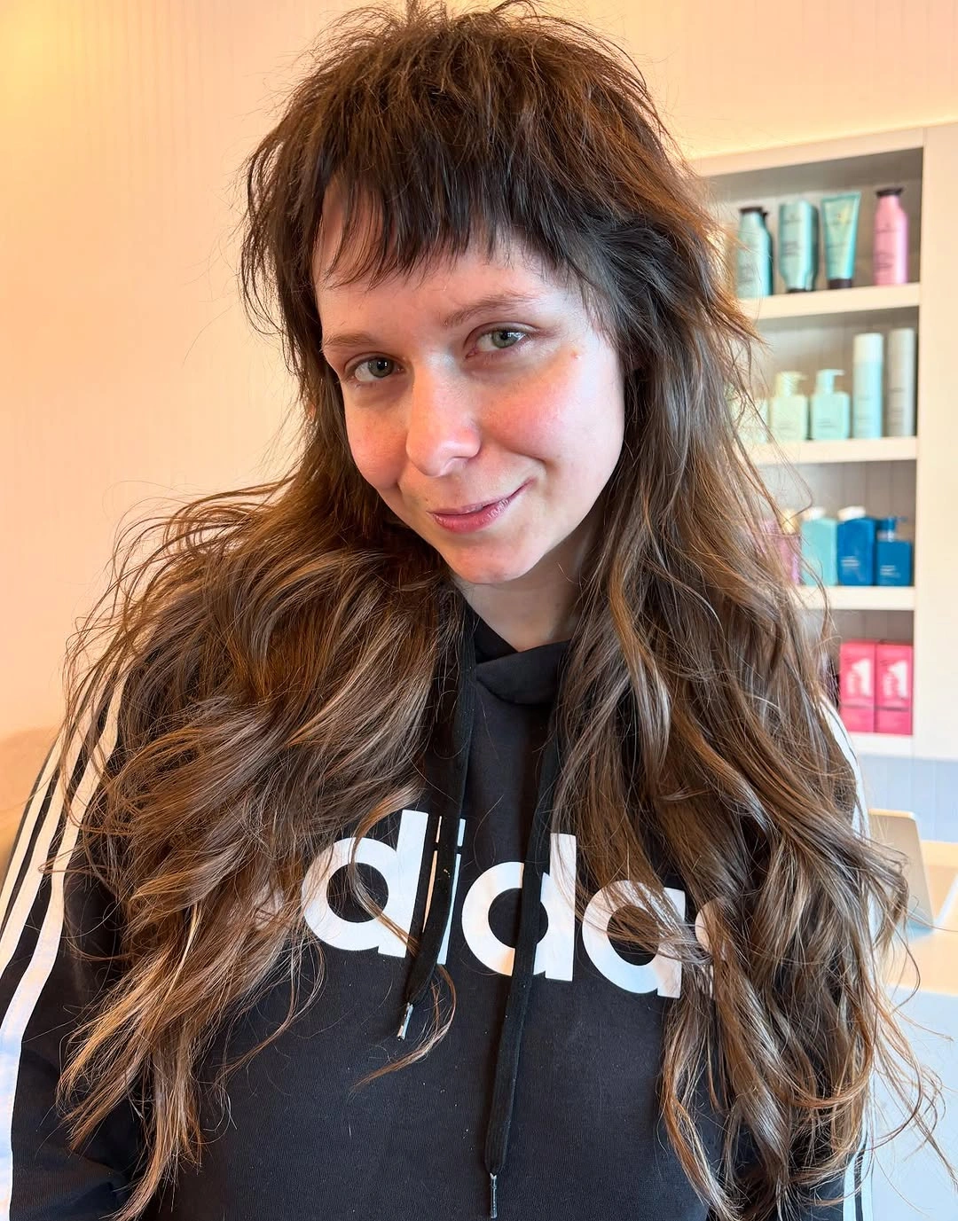 Long brown wavy shag with short bangs and choppy layers