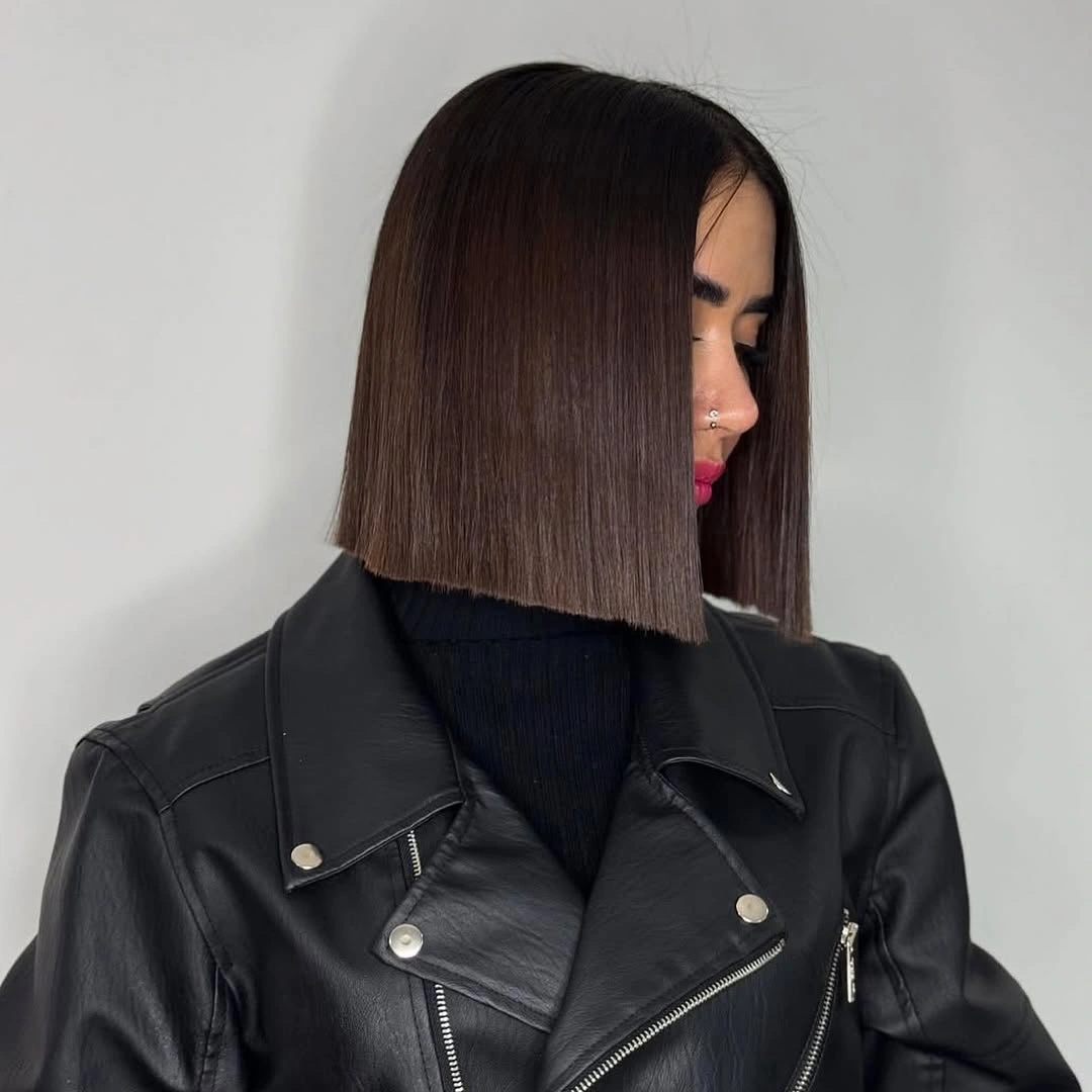 Sleek dark blunt bob with center part and straight edge