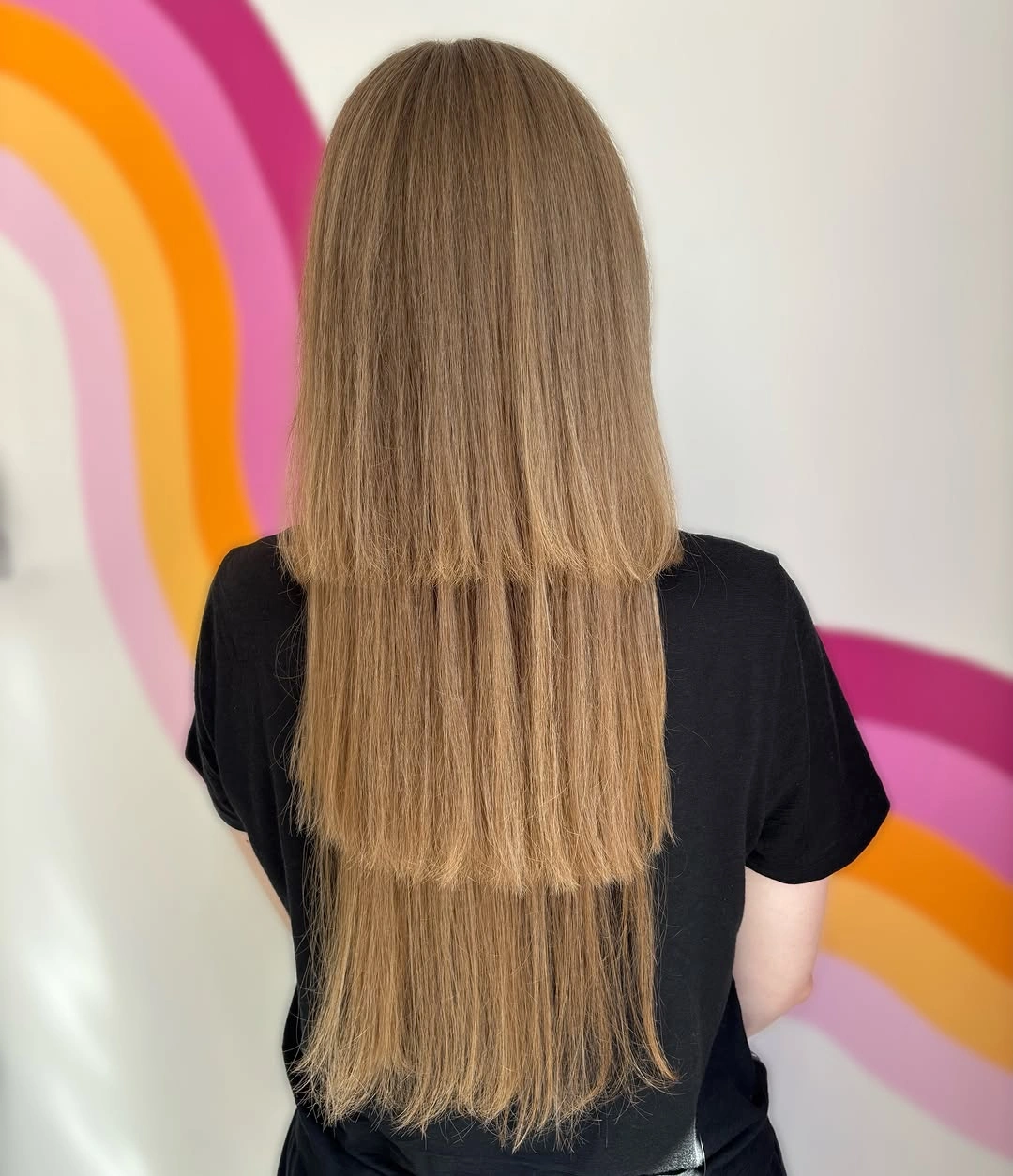 Long straight light brown hair with clean lower edges