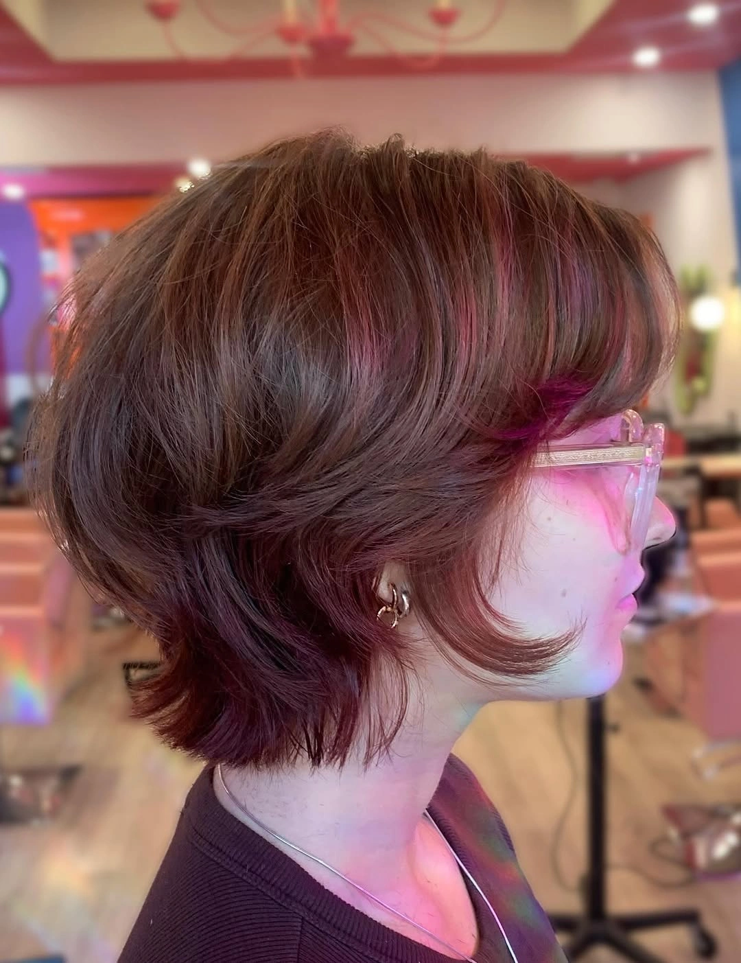 Short burgundy rounded bob with layered flipped ends