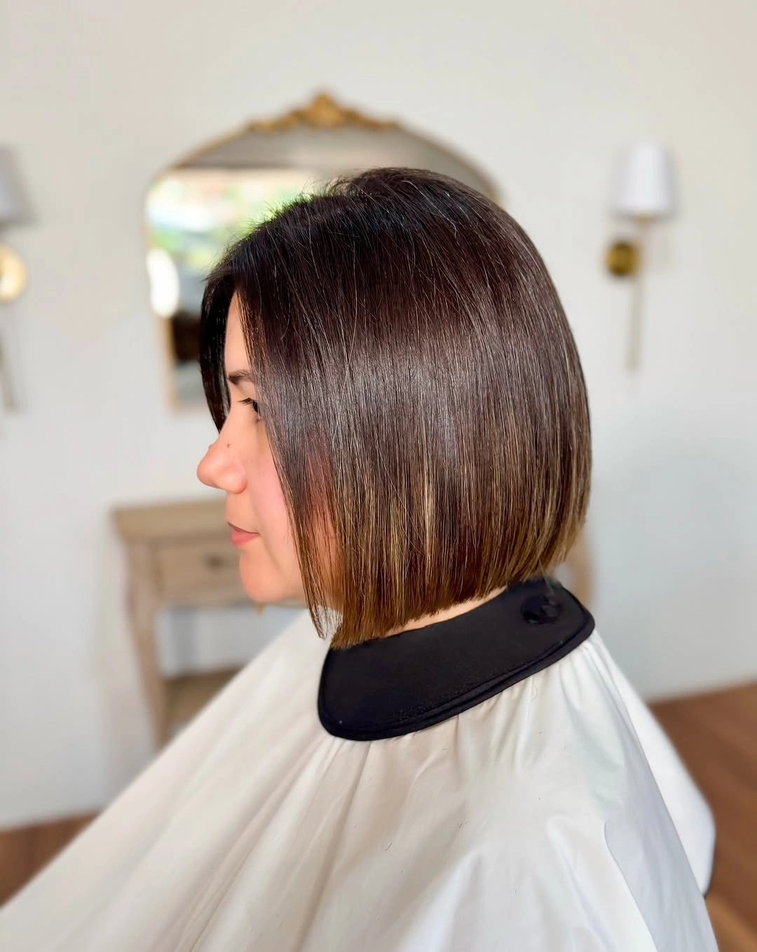 Straight dark bob with crisp jaw-level edge