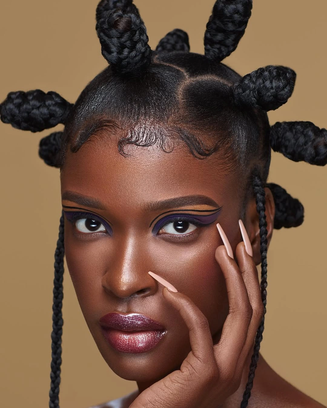 Sculptural braided knots with two long face braids