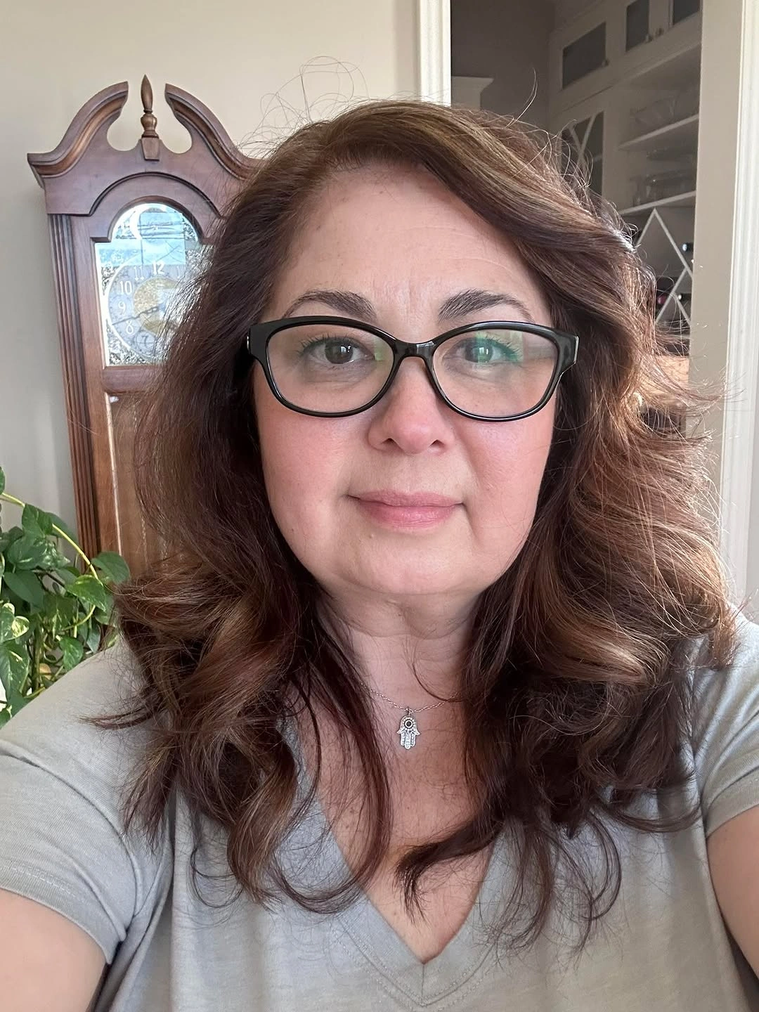 Medium brunette wavy hair with glasses and side volume