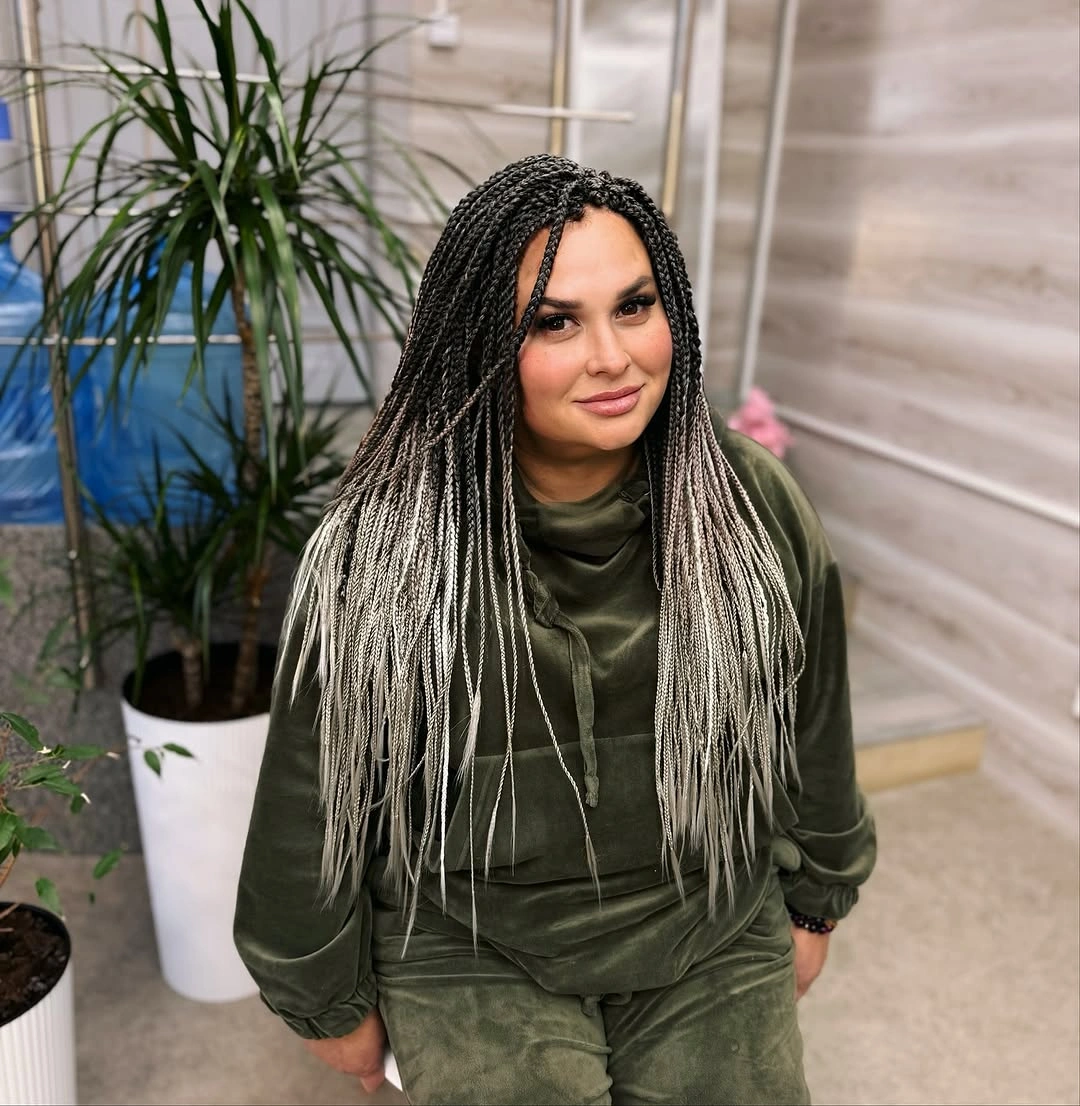 Long black braids with light lower sections over front