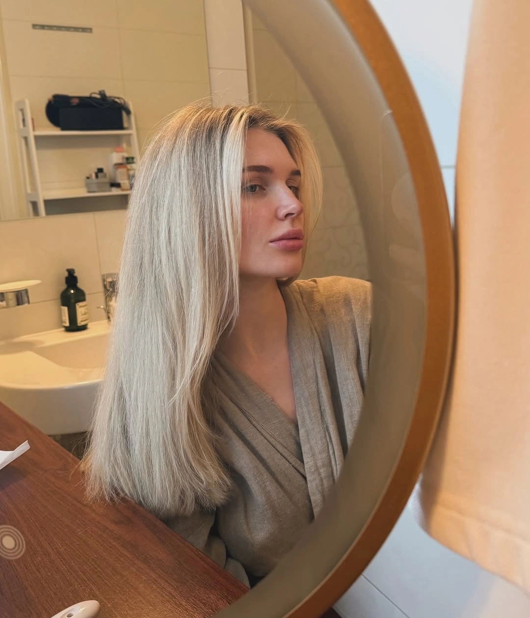 Very long pale blonde straight hair with center part