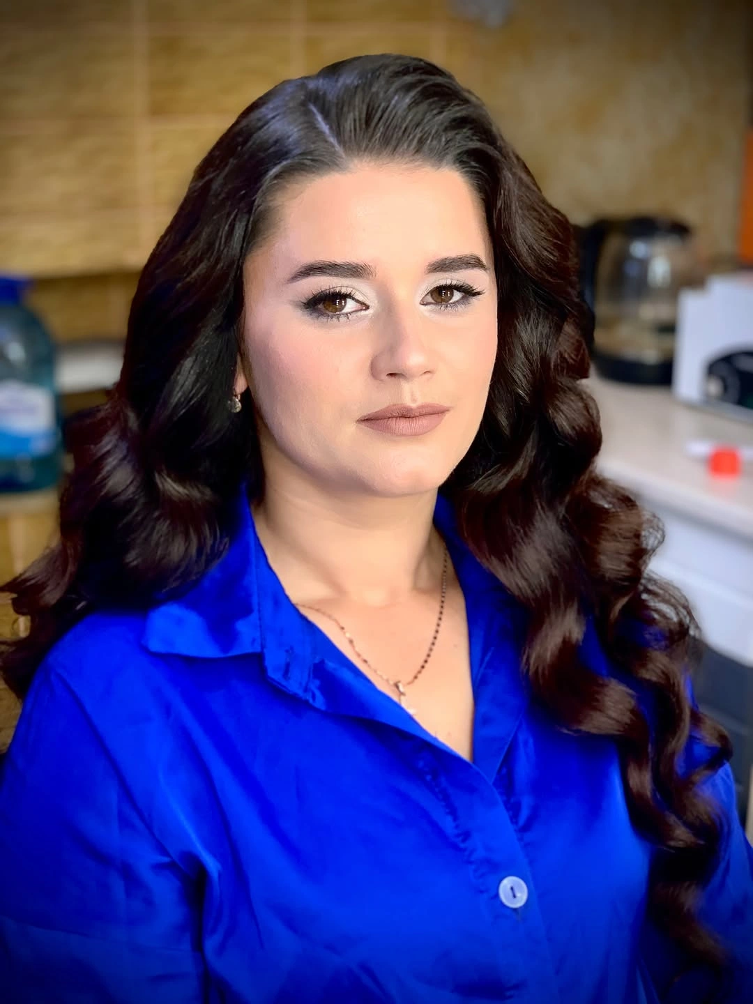Long dark brunette hair with center part and large waves