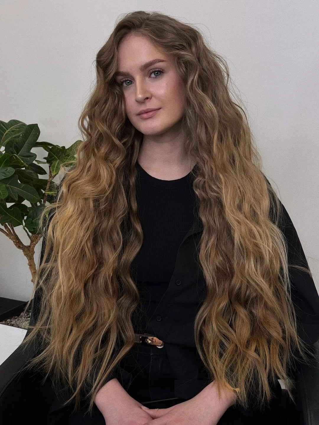 Very long light brown blonde hair with loose waves