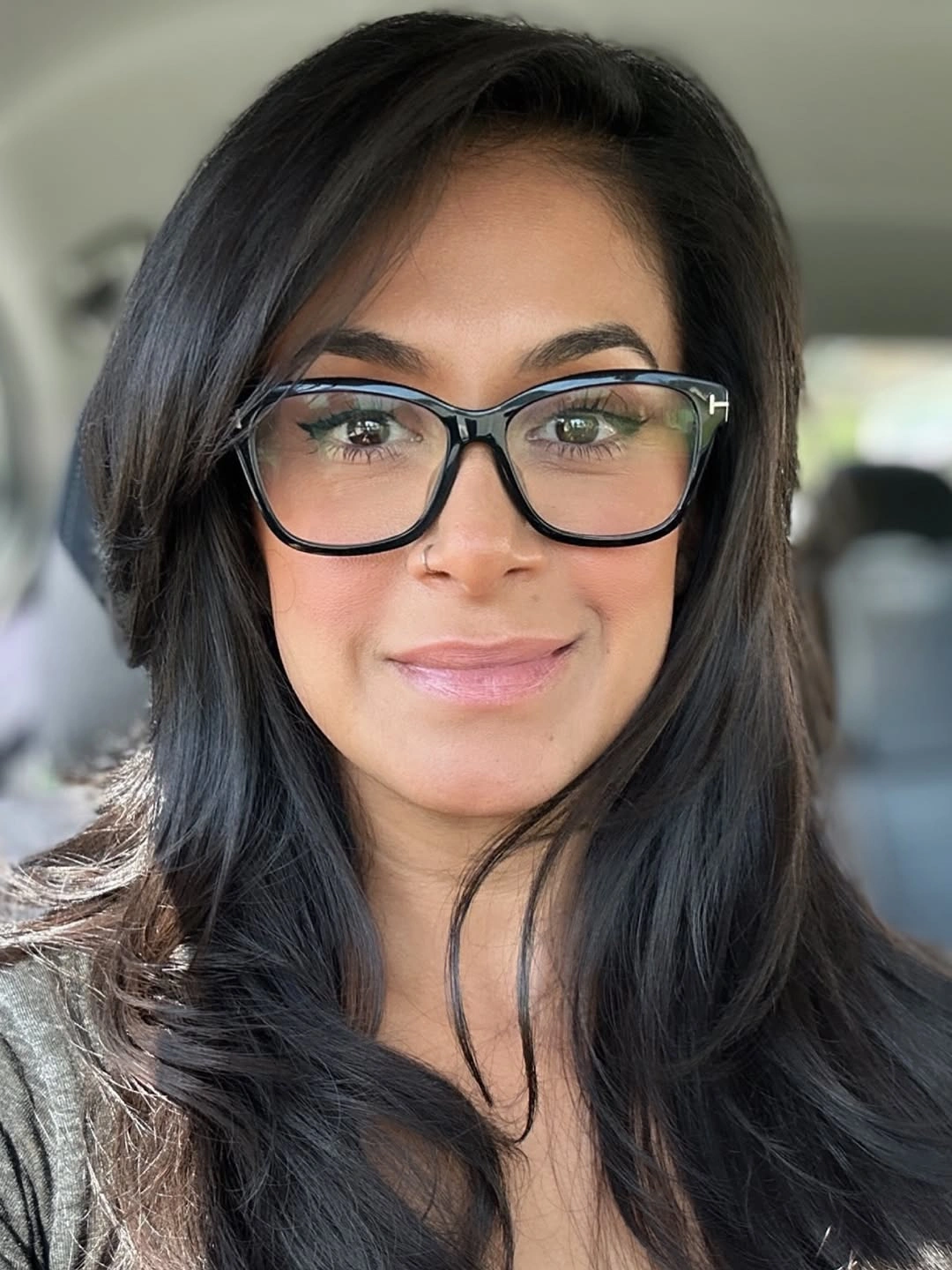 Long dark hair with glasses and side-swept front layer