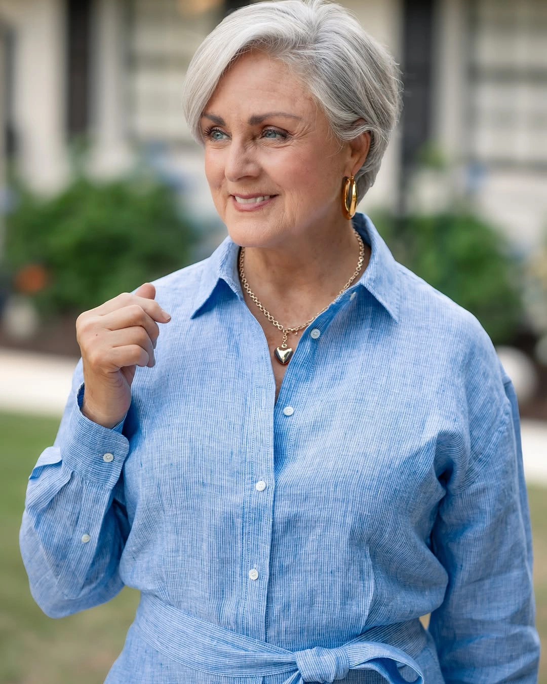 Short silver side-swept crop with exposed ear and compact nape