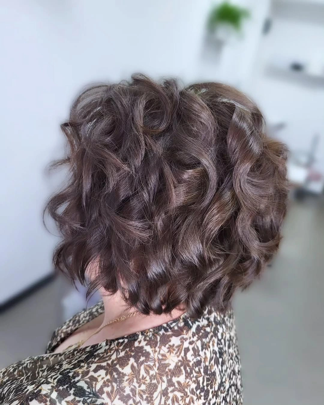 Short brown wavy haircut viewed from the back