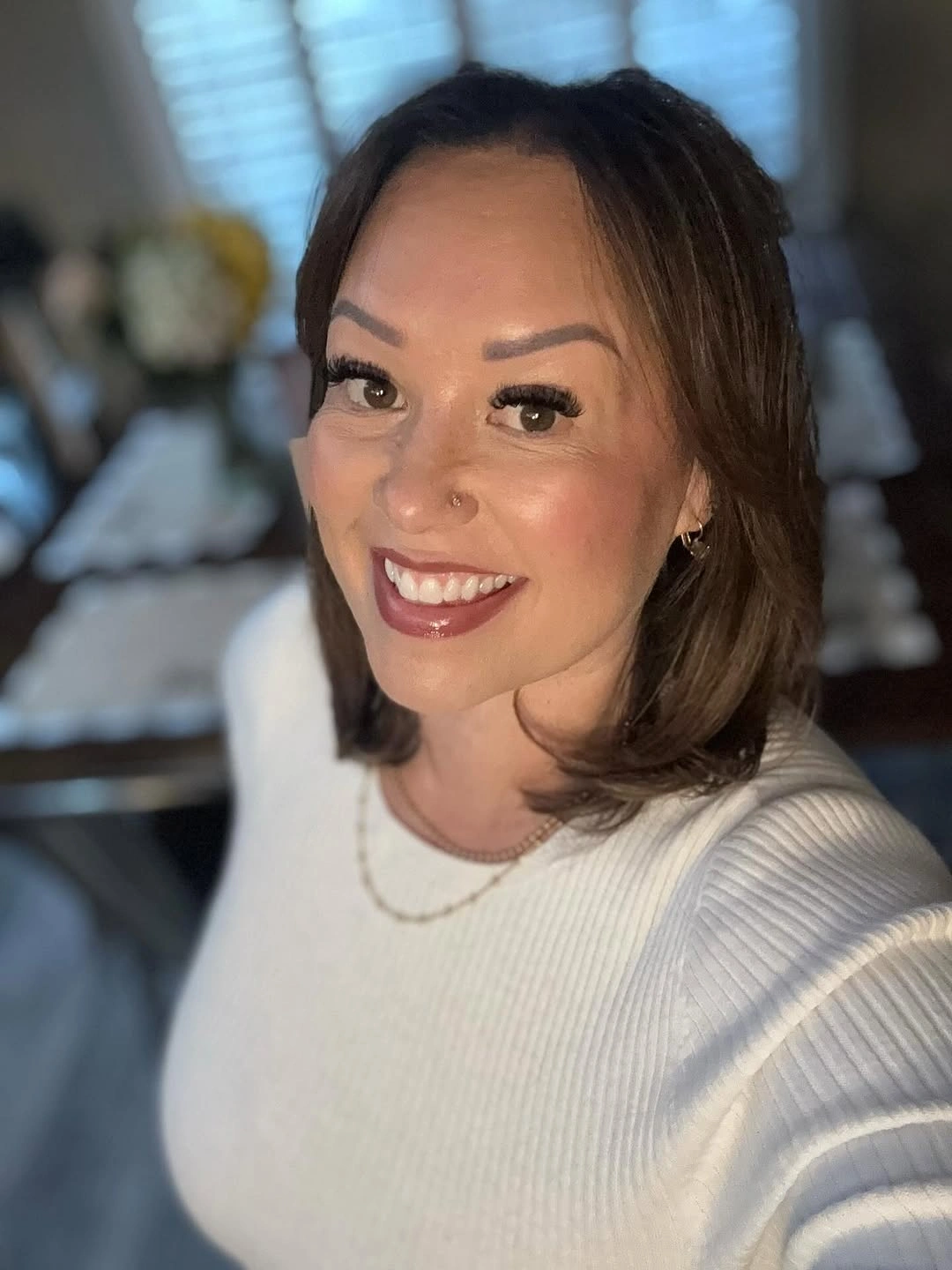 Shoulder-length brunette hair with center part and softly curved ends