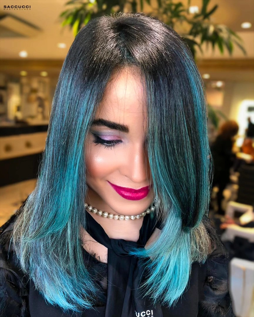 Straight dark shoulder-length hair with turquoise lower color