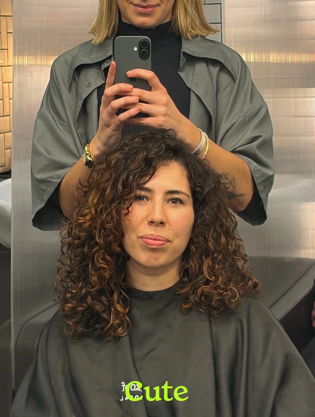 Medium curly shoulder-length hairstyle with rounded side volume