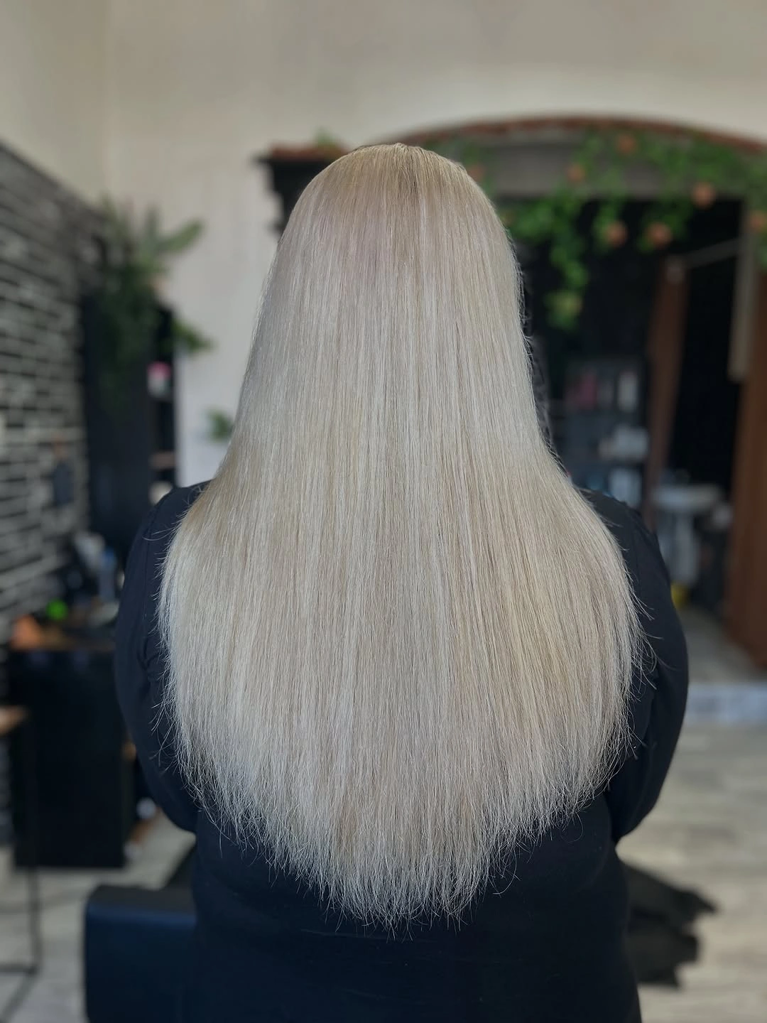 Very long pale blonde straight hair with rounded lower edge