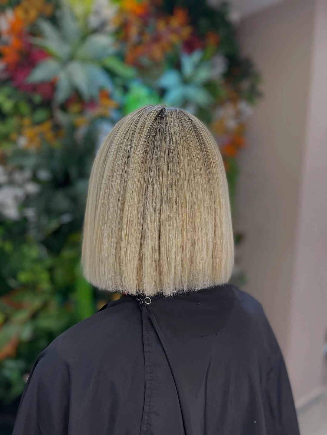 Blonde blunt bob from back with straight neck-length edge