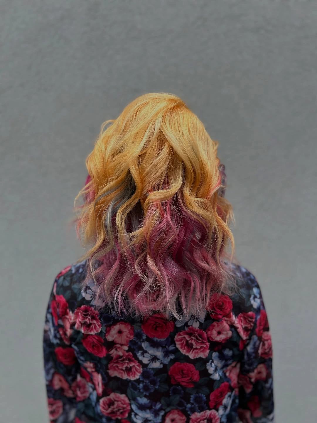Long golden blonde hair with pink and mauve lower waves