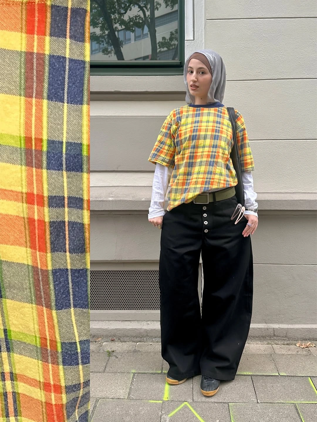 Plaid short-sleeve top over white layer with black trousers