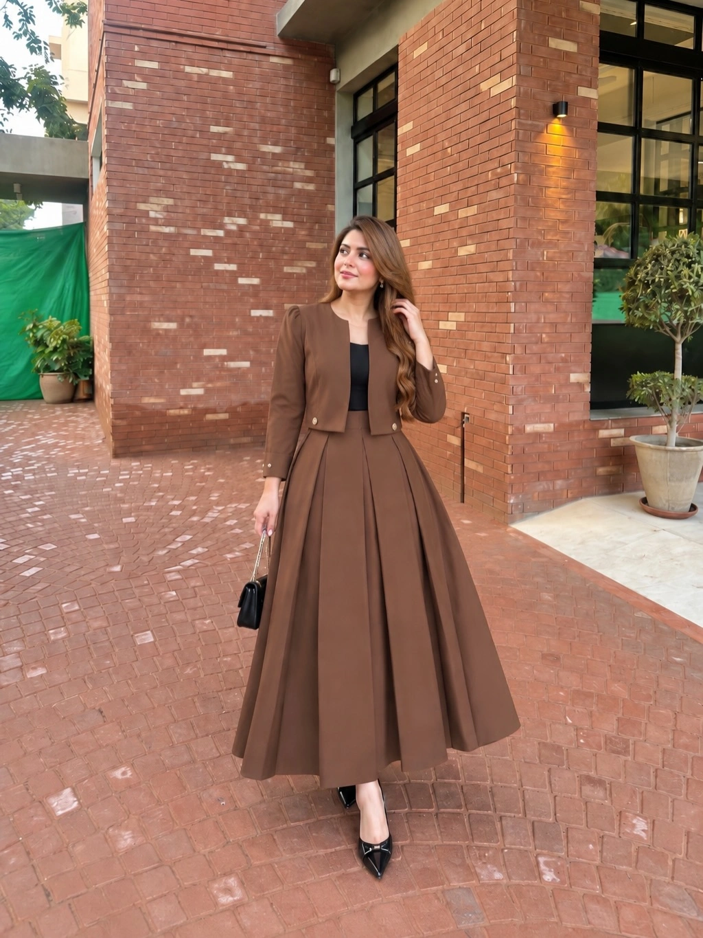 Brown cropped jacket with pleated midi skirt and black heels