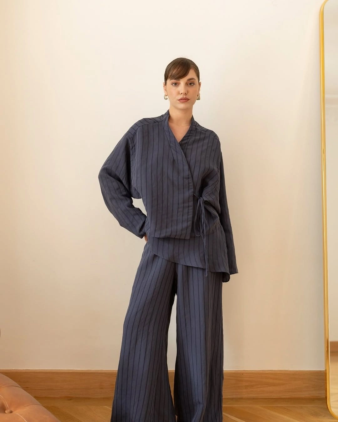 Dark pinstriped coordinated separates with wide trousers