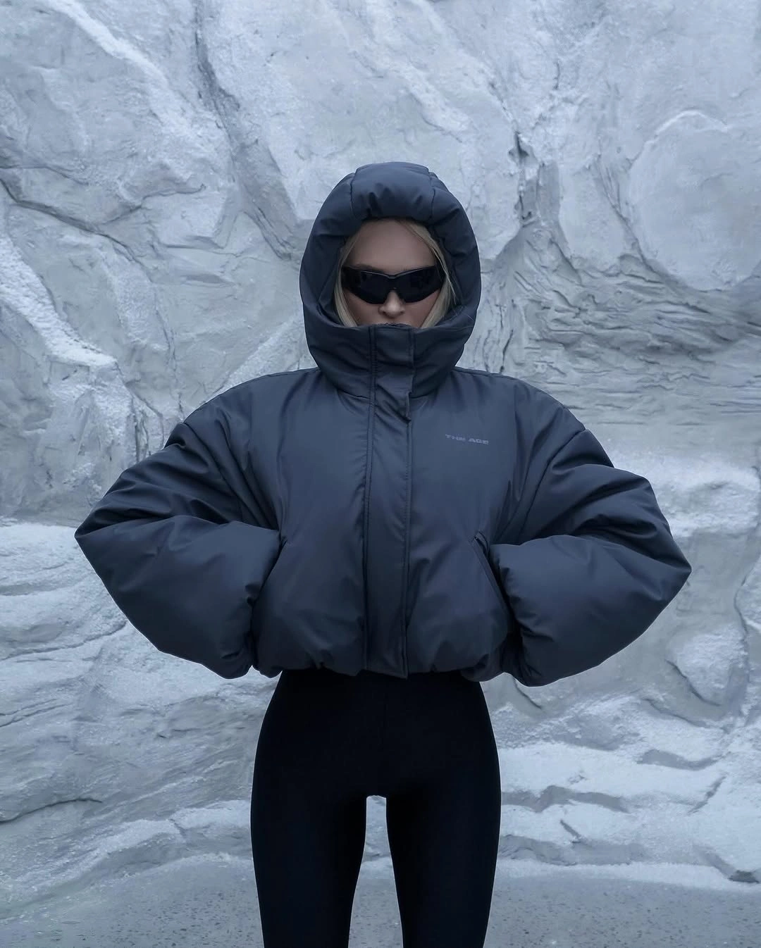 Charcoal hooded puffer zipped high with black leggings