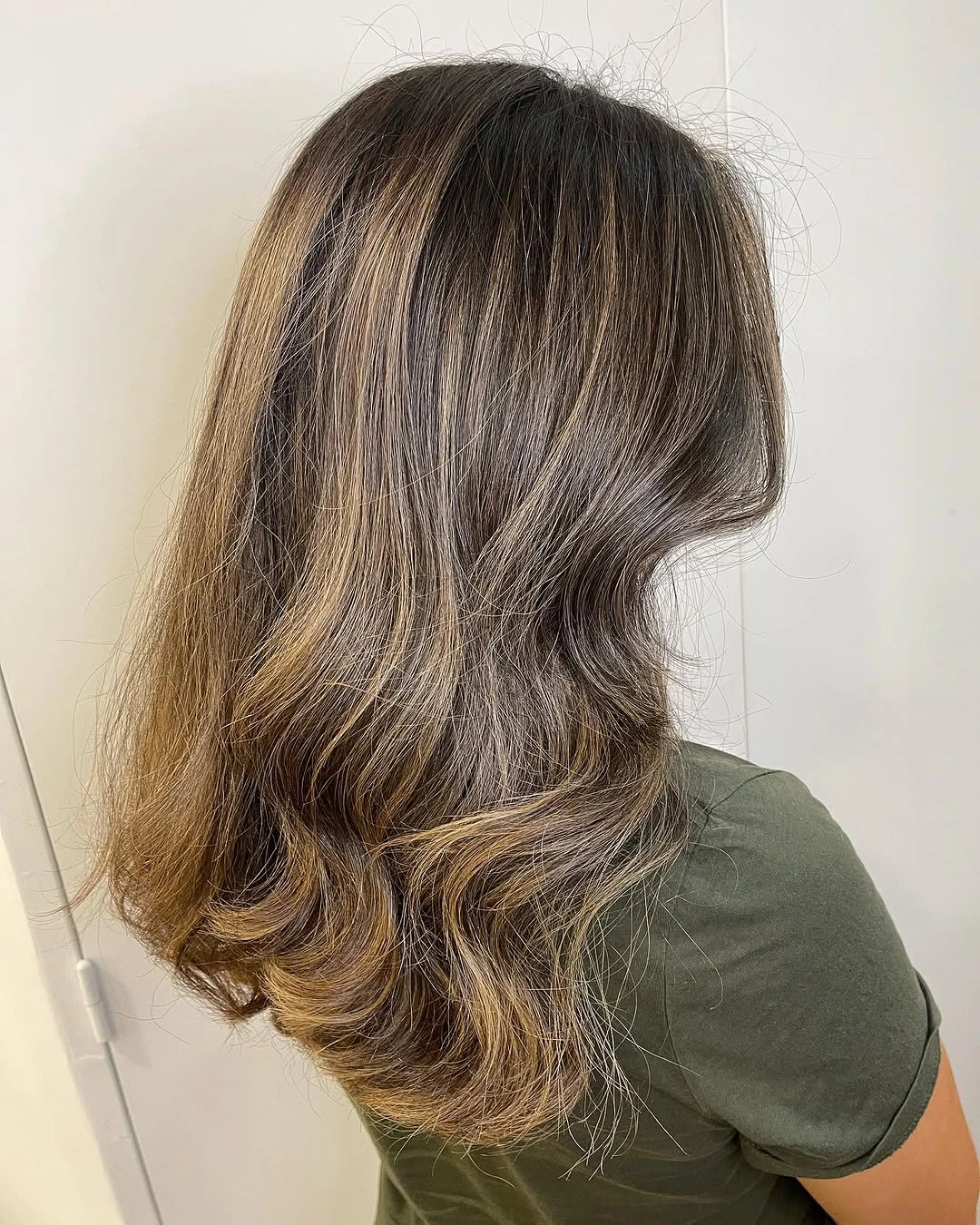 Medium deep brown waves with beige caramel and muted golden strands