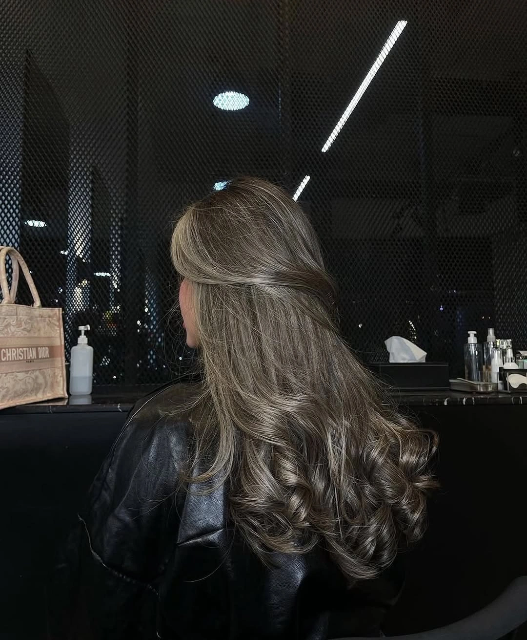 Half up cool brown hair with silver beige ribbons and broad curls