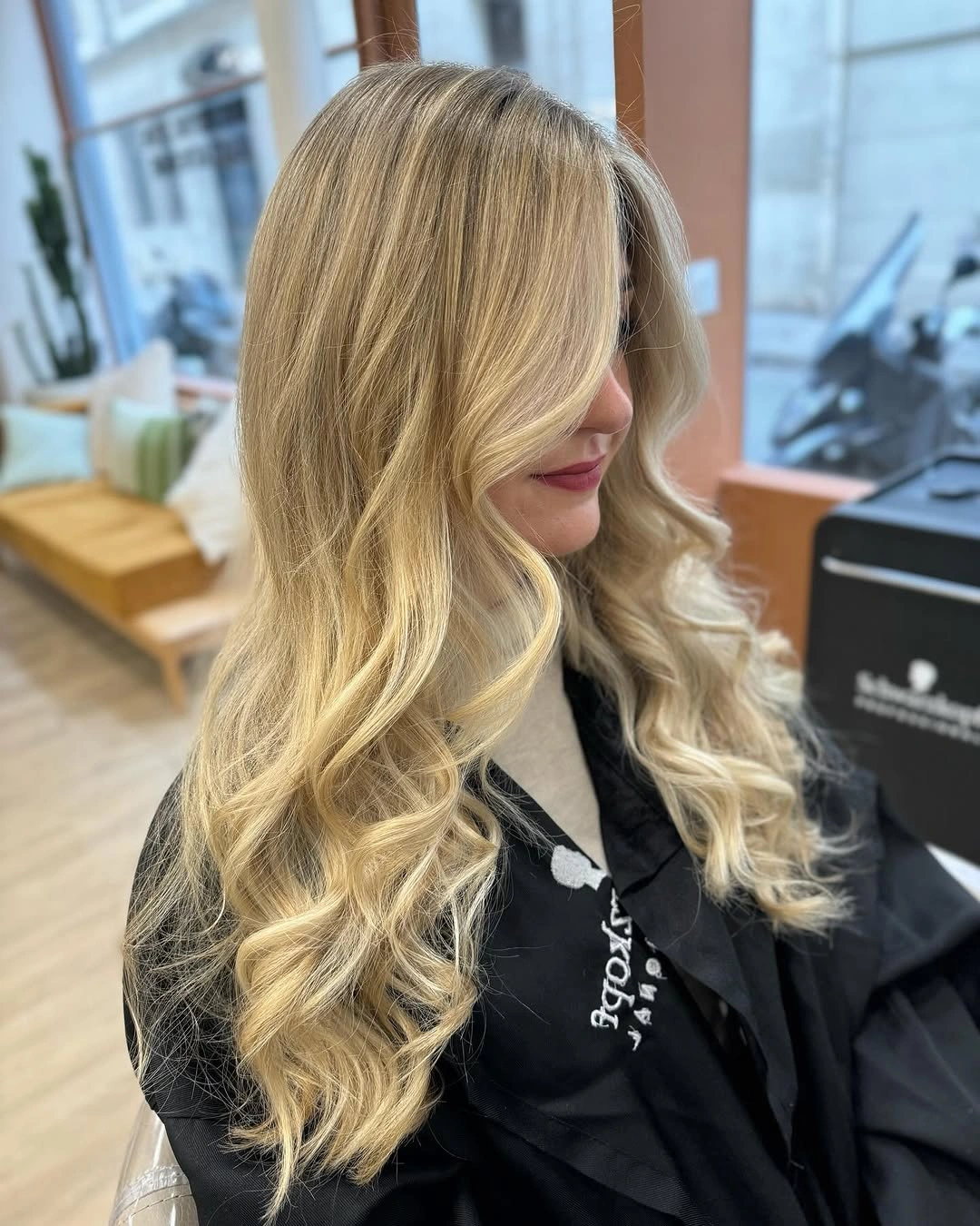 Long polished golden blonde waves with honey variation and bright face framing