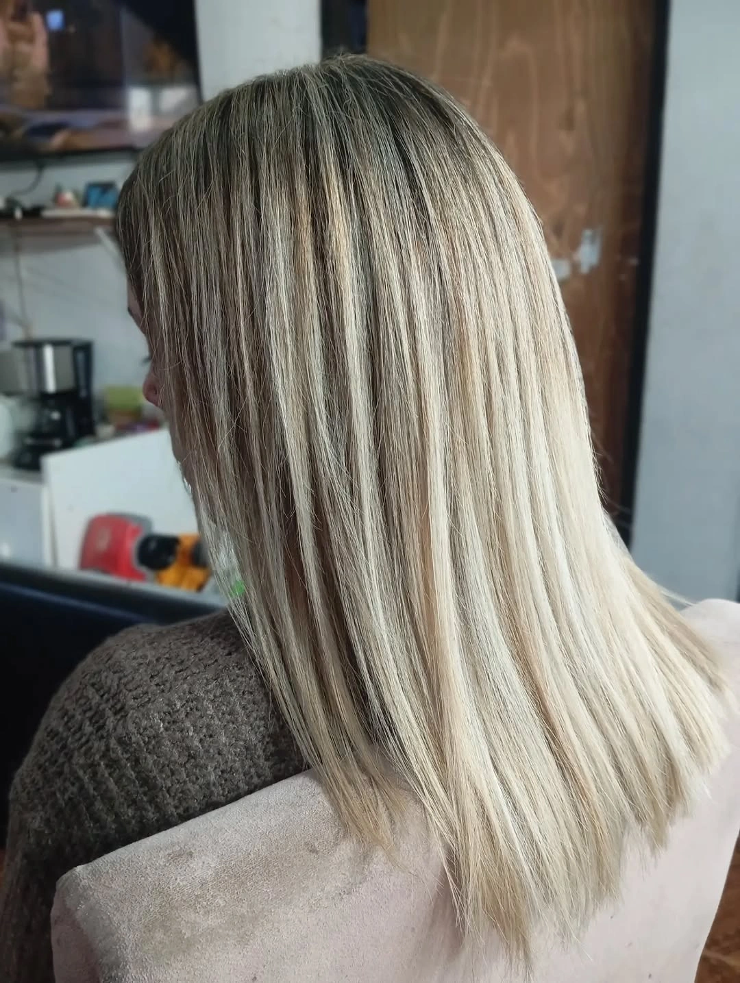 Straight blonde hair with dark ash base and ribbons