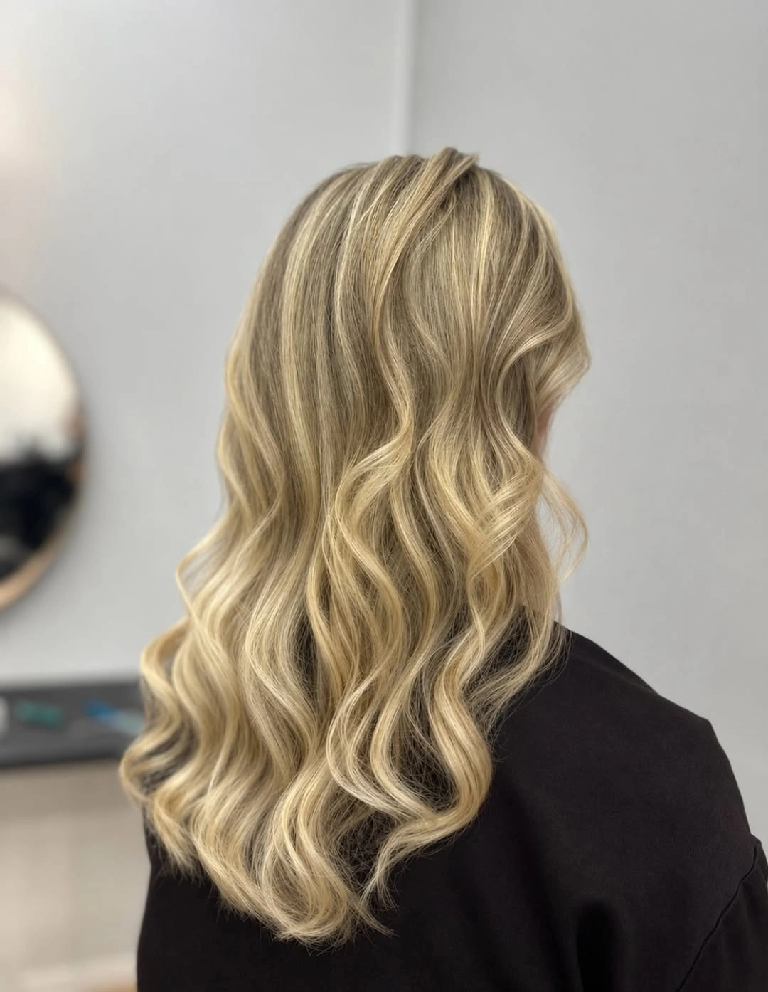 Blonde waves with caramel beige lowlights and bright ribbons