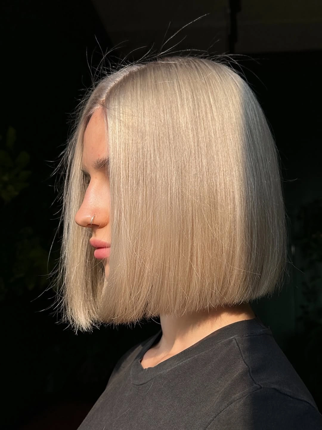 Short warm beige blonde bob with blunt straight ends