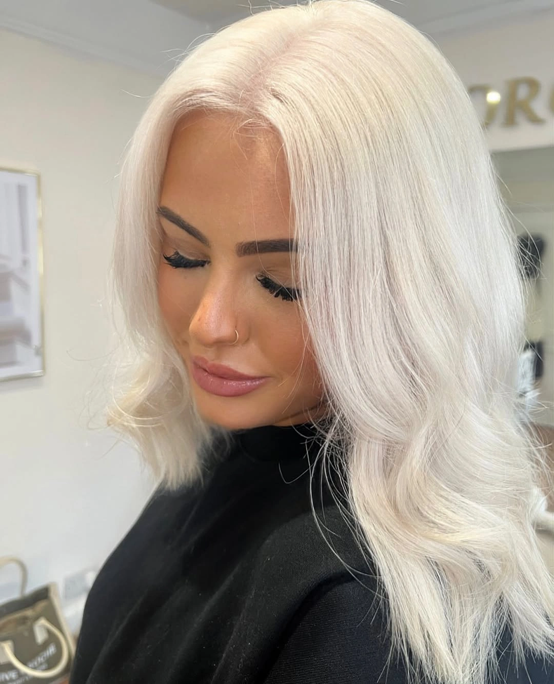 White platinum blonde waves with soft side part