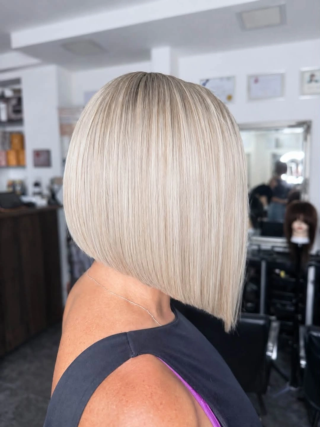 Pale blonde blunt bob with fine vertical variation