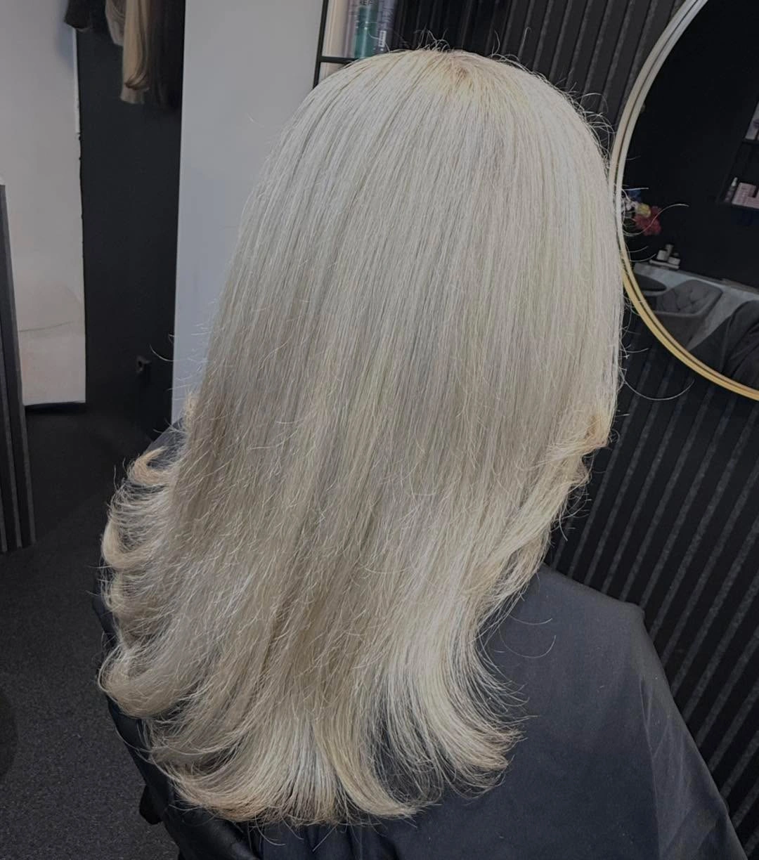 Long pale ash cream blonde hair with rounded layers