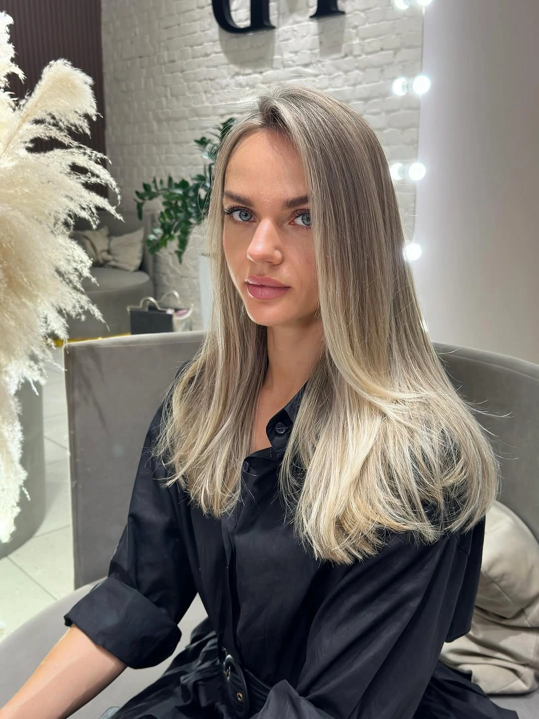 Medium straight blonde hair with taupe crown and creamy ends