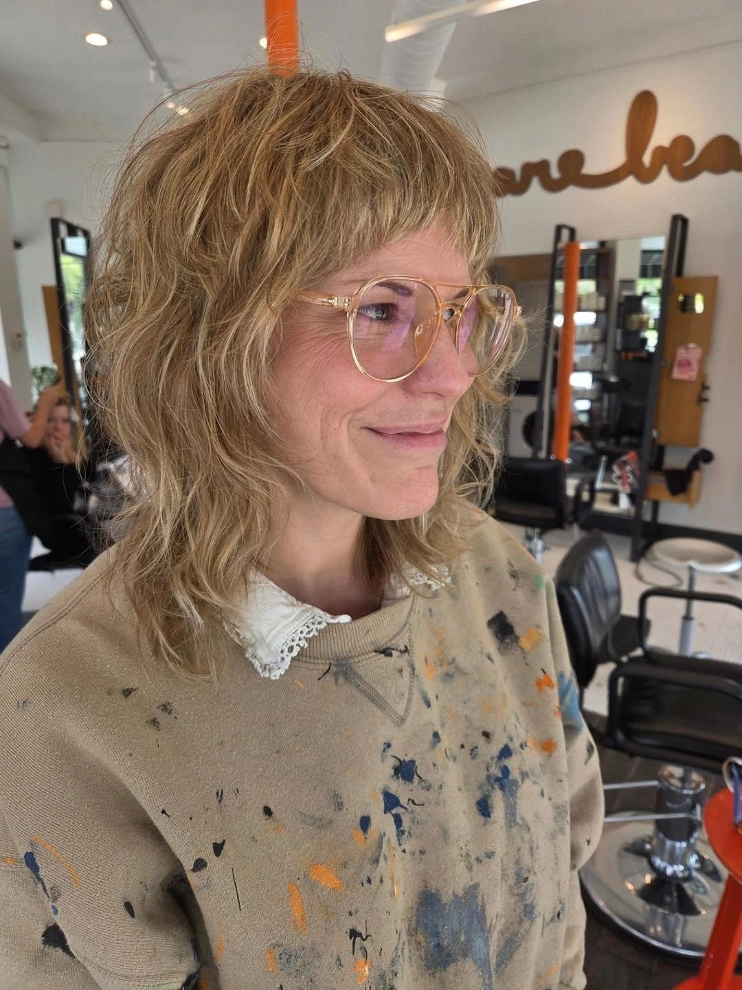 Short shaggy honey blonde hair with bangs