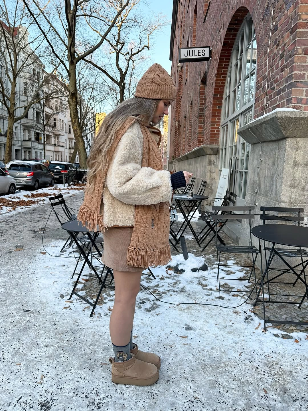 Cream short jacket with camel scarf, beanie and boots