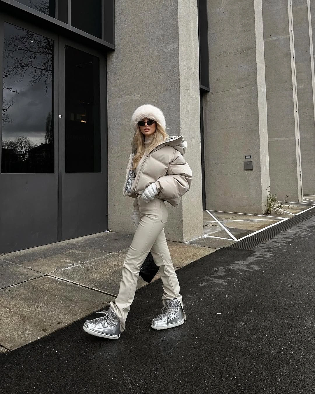 Pale puffer with slim trousers and silver high-top sneakers