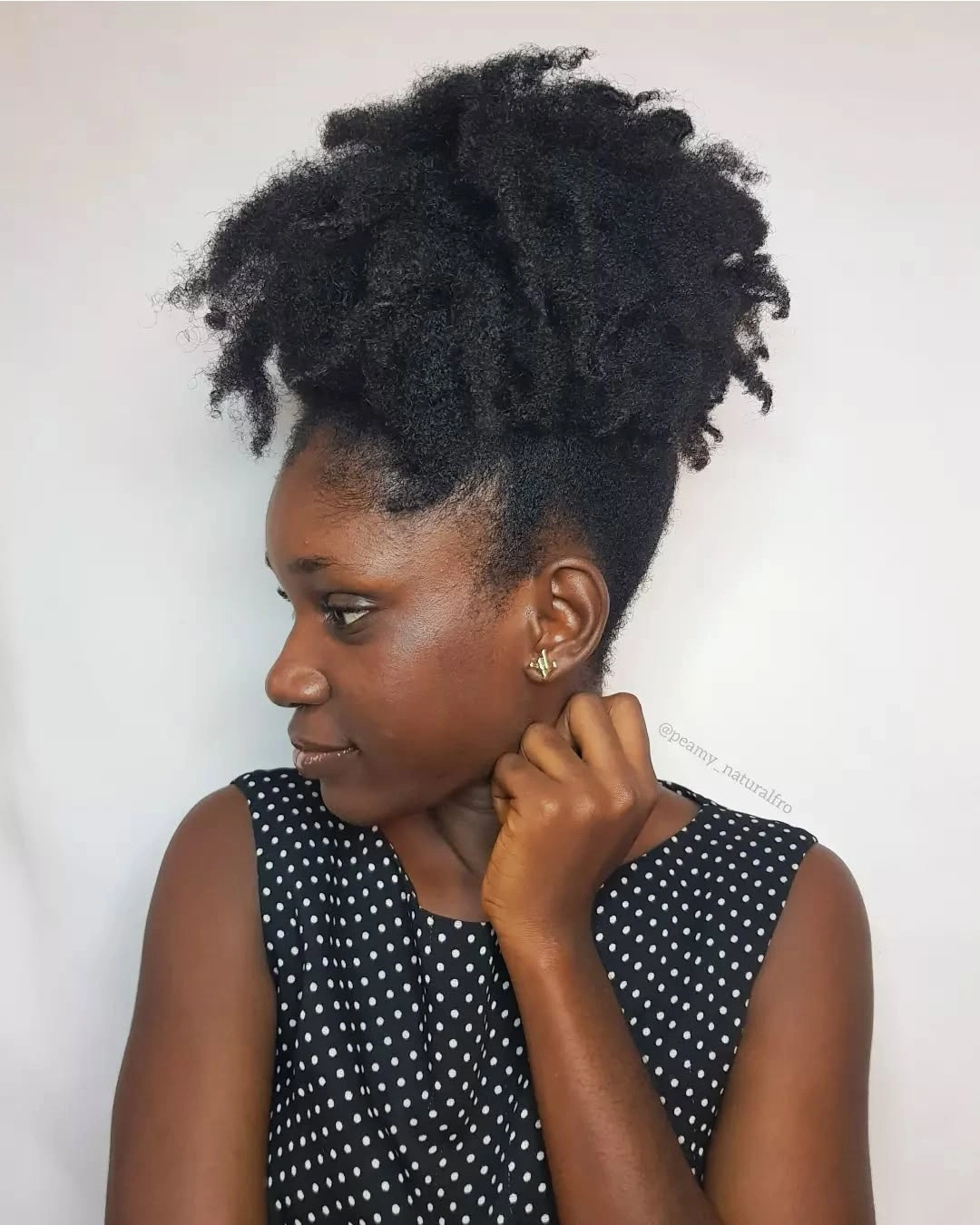 High black coily puff with soft flyaways and polka dot top