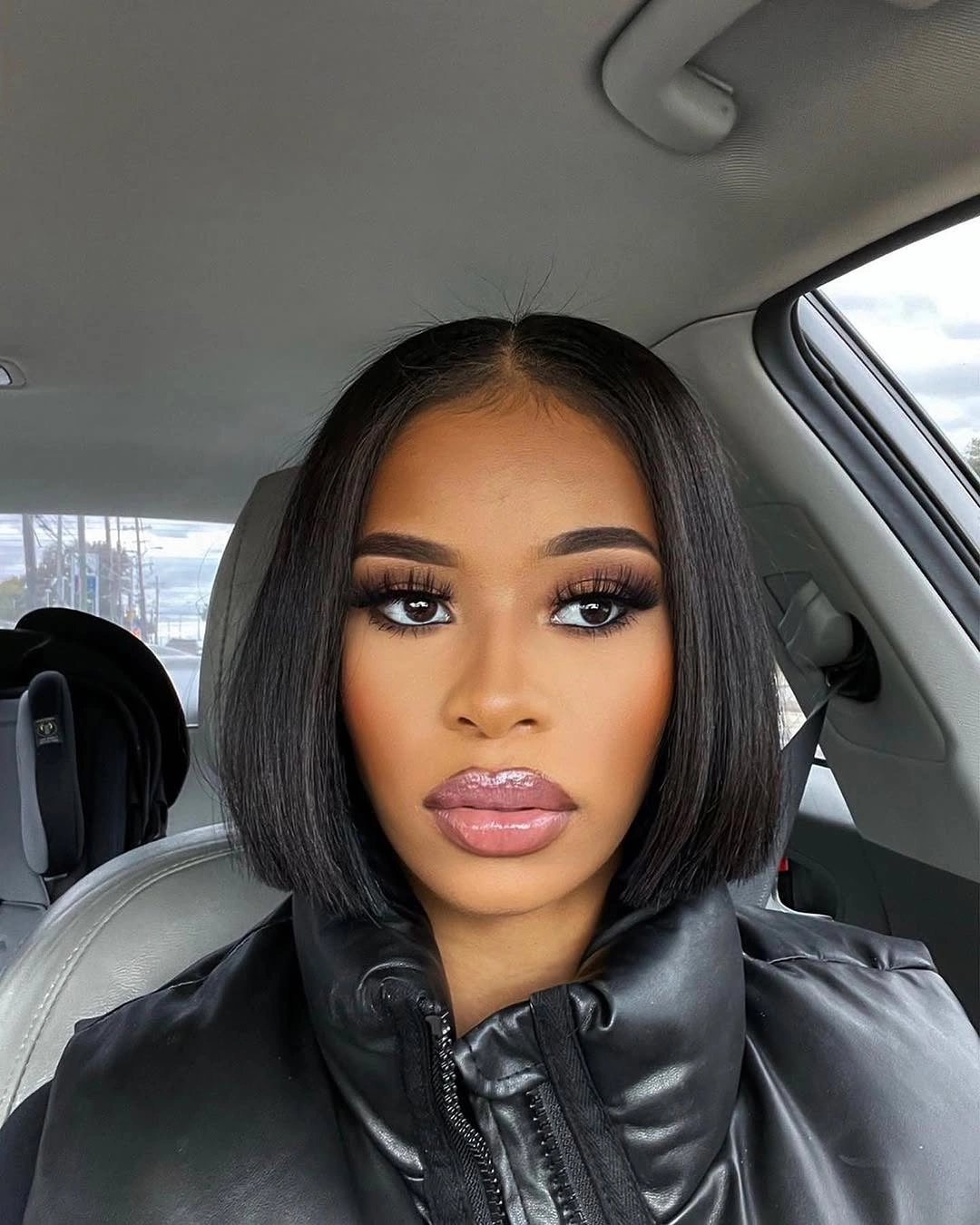 Sleek chin length espresso black bob with center part